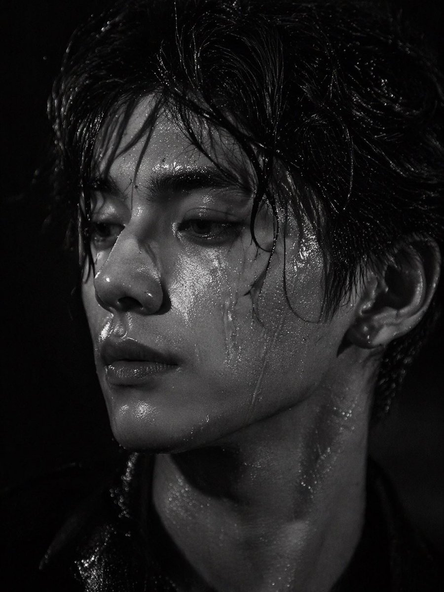 striking black and white close-up portrait of a handsome young Asian